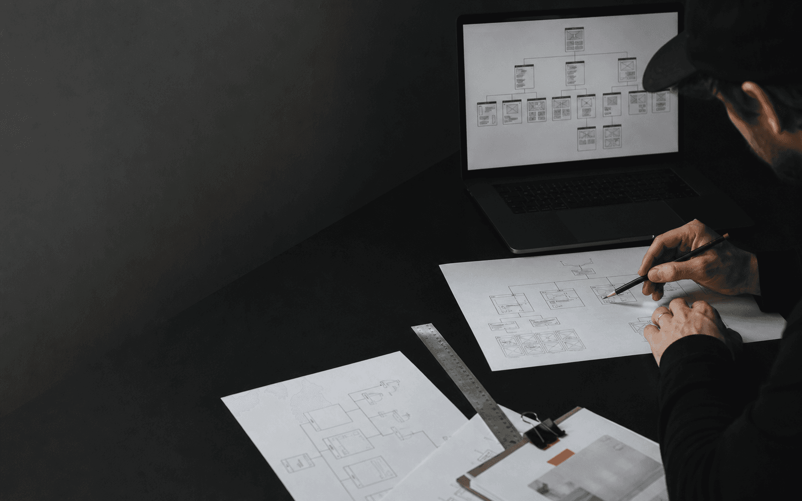 Wireframes and route structure being shaped on a laptop before design begins